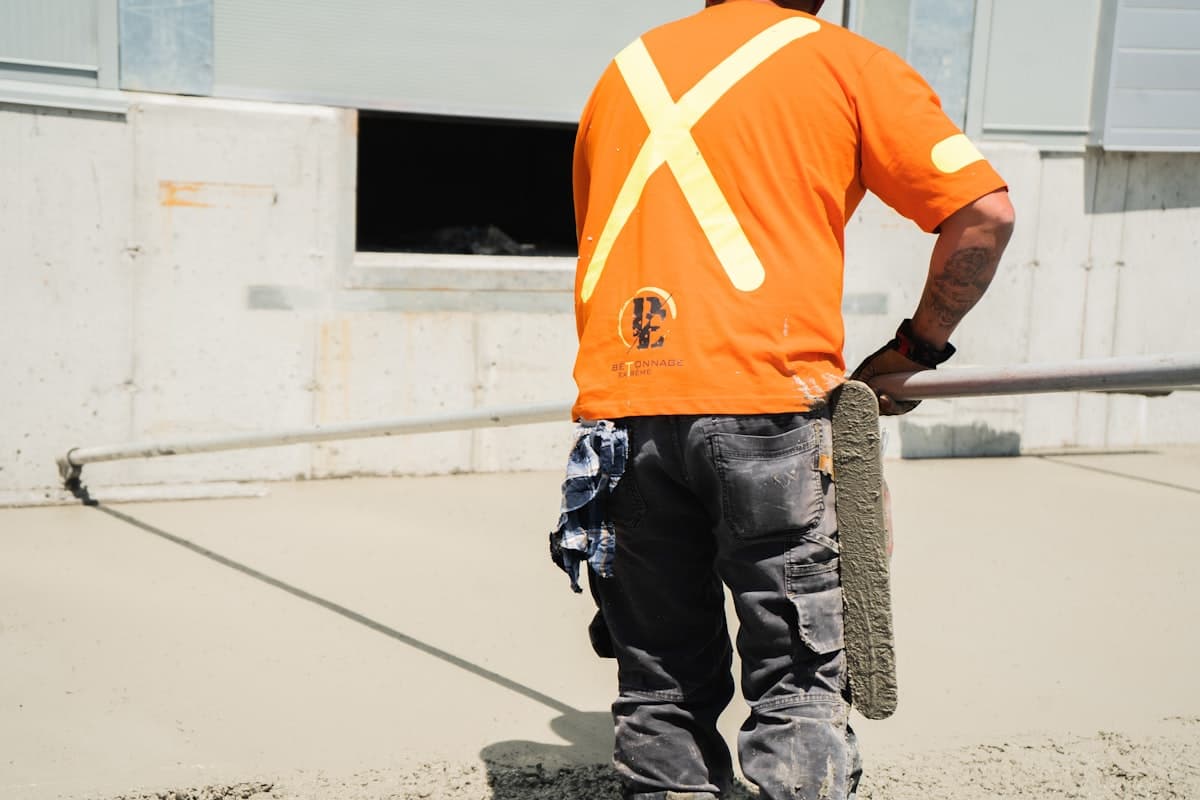 Concreters screeding a freshly poured slab