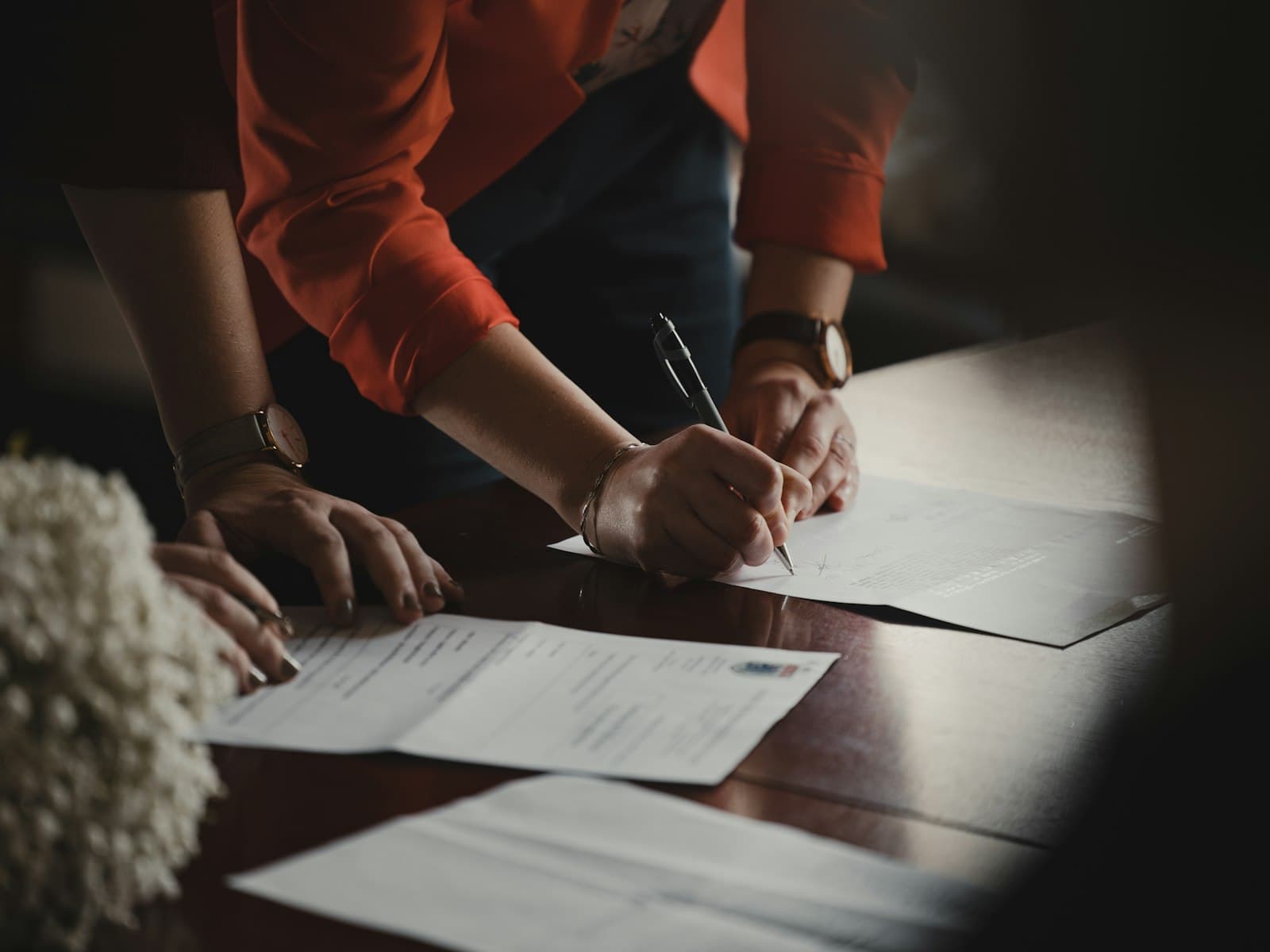 Paperwork and a pen on a table